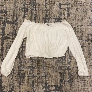 Cropped white top in sized L. In Good condition